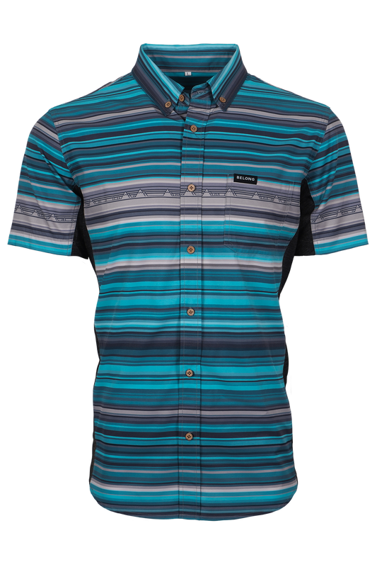 The Vista Stretch Button Down from Belong Designs features a modern, casual design in Summit Teal. This short-sleeve shirt includes a buttoned-down collar and is crafted from wrinkle-resistant fabric. It also comes with a small chest pocket adorned with a logo patch reading "Belong Designs.